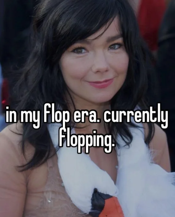 Woman with smirk captioned 'in my flop era. currently flopping.' in white text.