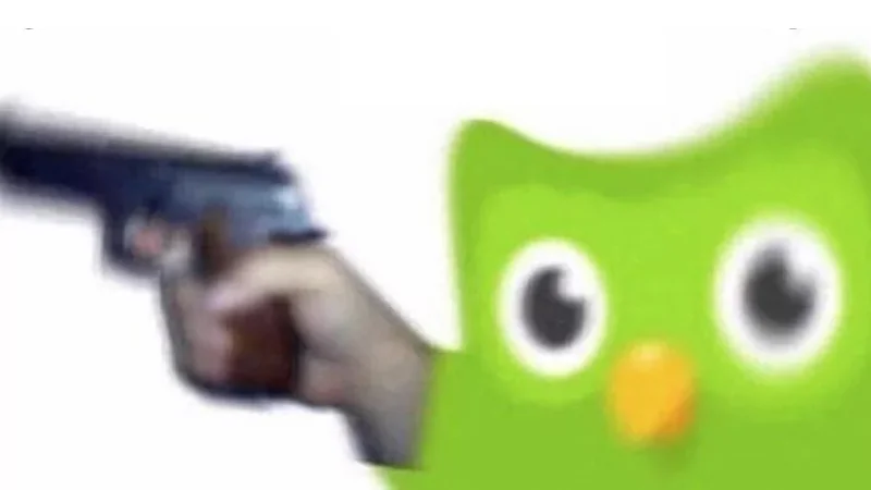 Evil Duolingo Owl — Green Duolingo owl mascot holding a pistol