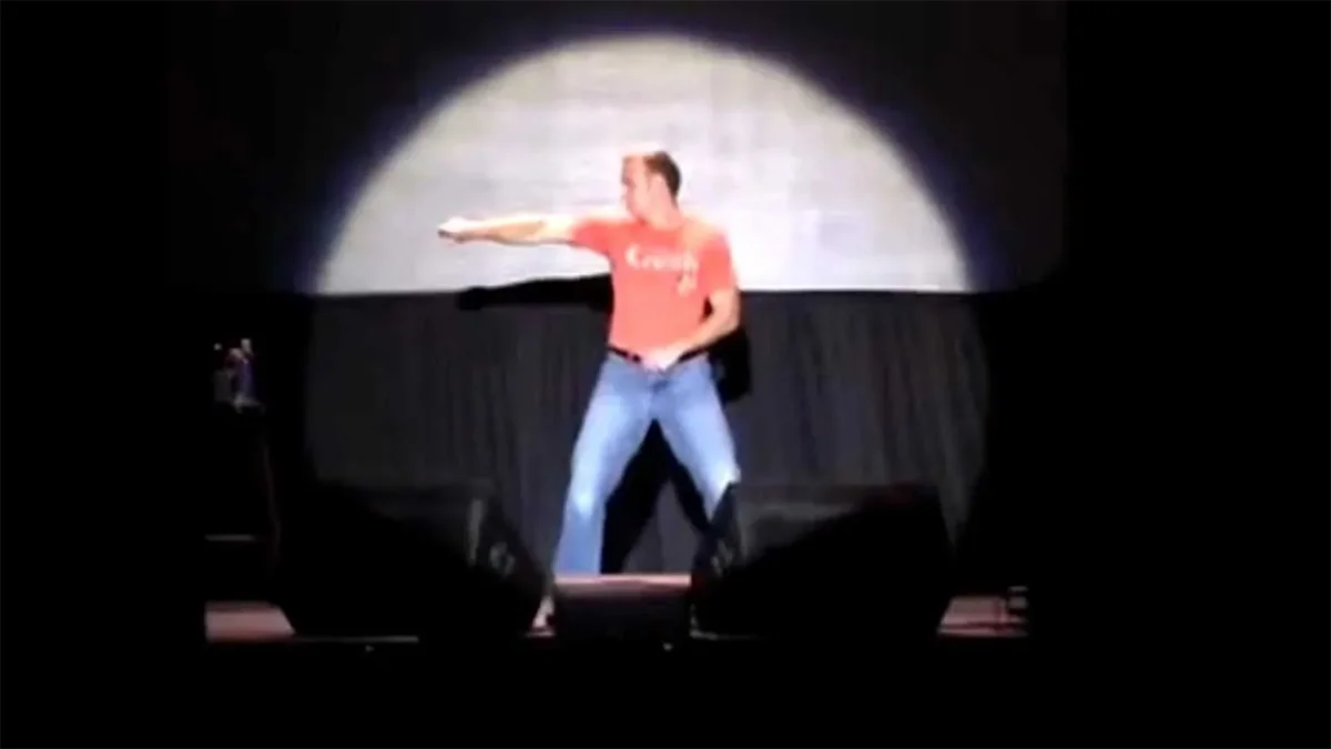 Evolution of Dance — Performance still of Judson Laipply on stage under spotlight during dance routine.