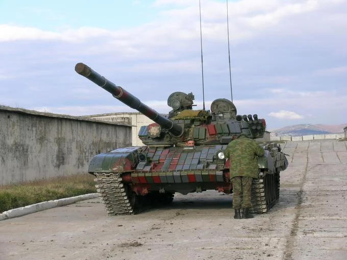 Explosive Reactive Armor Era — Russian T-72 tank covered in green and red Kontakt-1 explosive reactive armor blocks