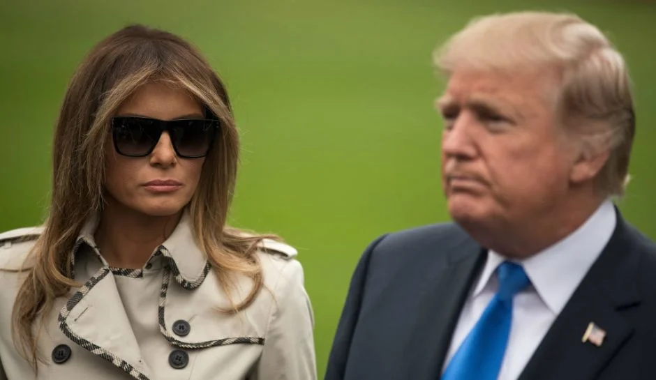 Fake Melania Trump Conspiracy — Melania Trump in sunglasses standing next to Donald Trump outdoors