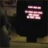 Fast Food Freestyle — Dark video still showing person silhouette at illuminated drive-thru order screen.