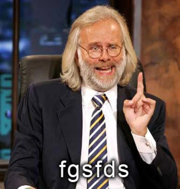 Bearded talk show host raising index finger with 'fgsfds' caption