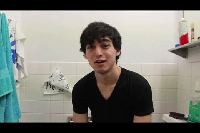 George Miller sitting in a bathroom speaking to the camera in a Filthy Frank video