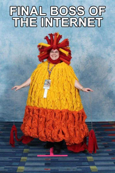 Final Boss Of The Internet — Person in elaborate yellow and red feathered costume as final boss.