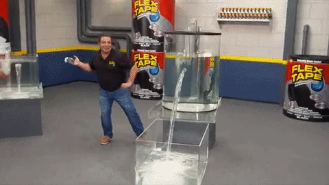Flex Tape — Phil Swift in demonstration pose from infomercial with product bottles.