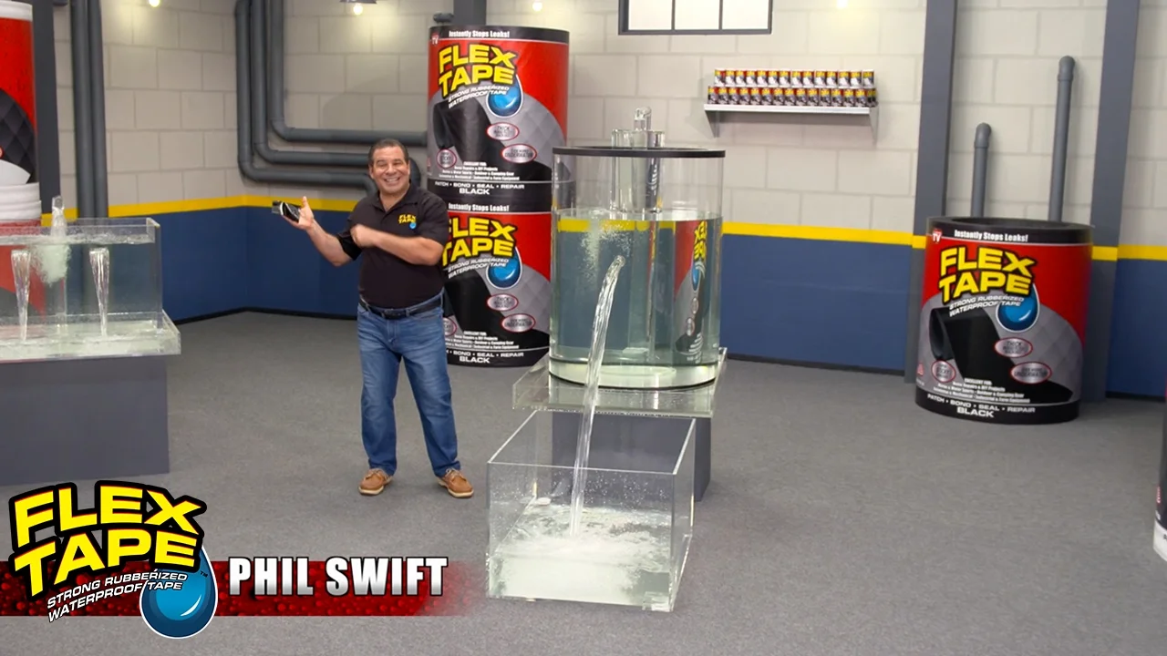 Phil Swift in signature pose with Flex Tape bottles and branding visible.