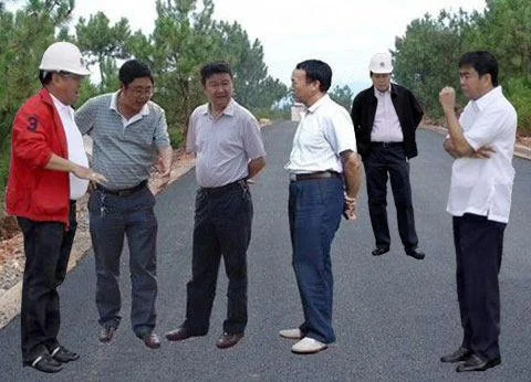 Floating Filipino Government Officials — Group of officials in hard hats on road or development site.