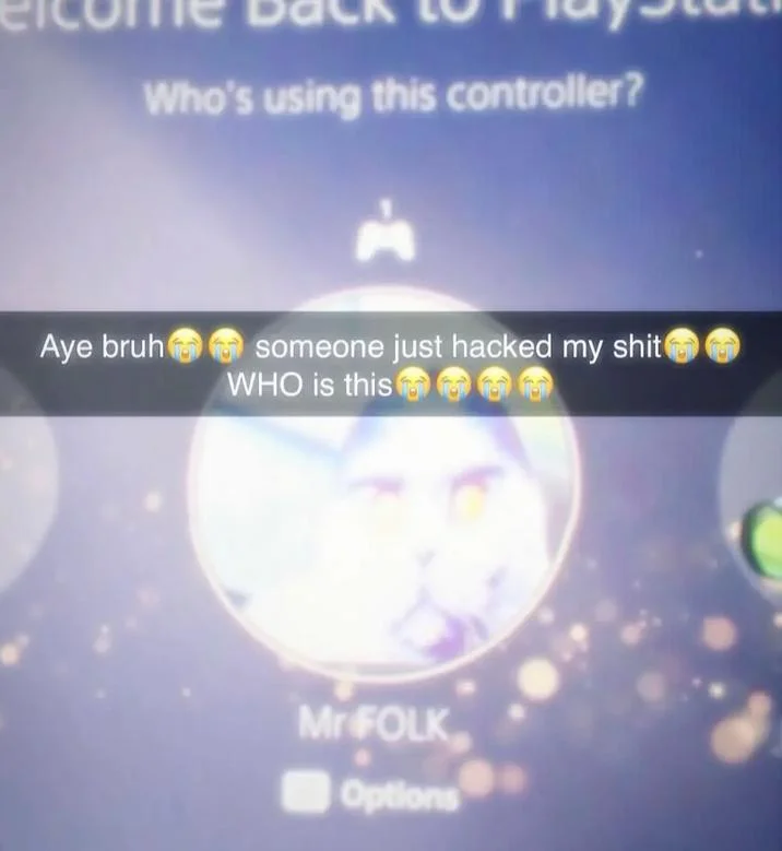 PlayStation login screen with Folk Valley cat as Mr FOLK profile avatar and joke caption about being hacked