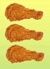 Food Porn — Three golden-brown fried chicken drumsticks on bright yellow-green background.