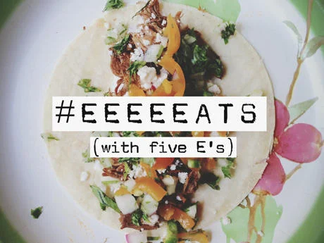 Food Porn — Flour tortilla taco with meat, peppers, cheese, herbs on plate.