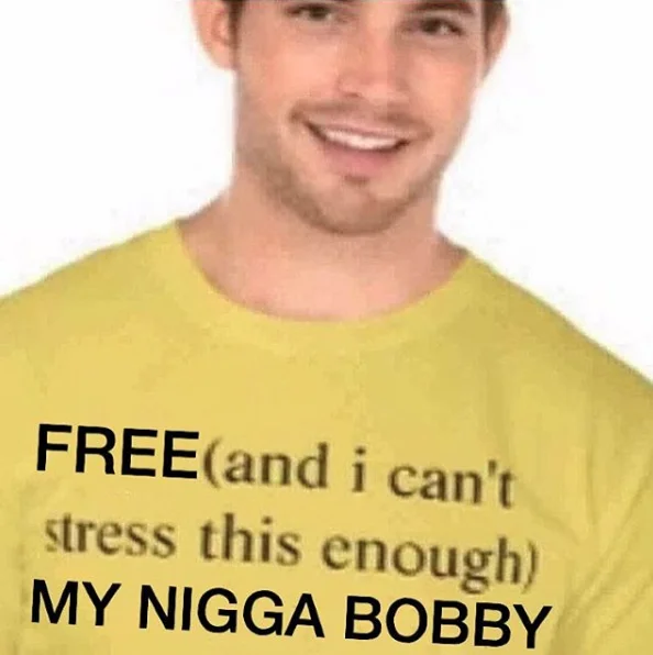 Free Bobby Shmurda — Man wearing yellow t-shirt reading 'Free (and I can't stress this enough) my nigga Bobby'