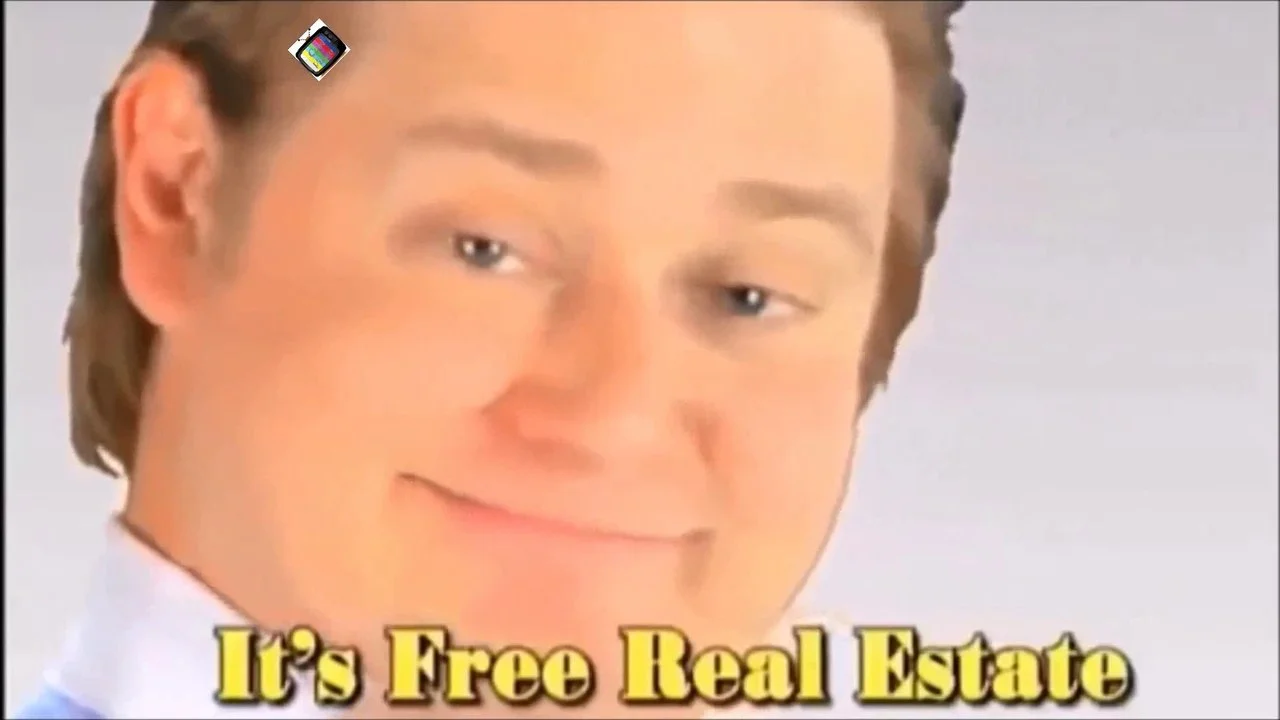Man with pleased smug expression and 'It's Free Real Estate' text.