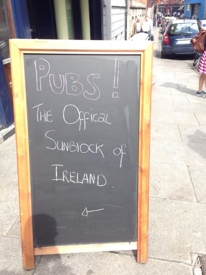 Funny Store Signs — Chalkboard pub sign reading 'Pubs — the official sunblock of Ireland'