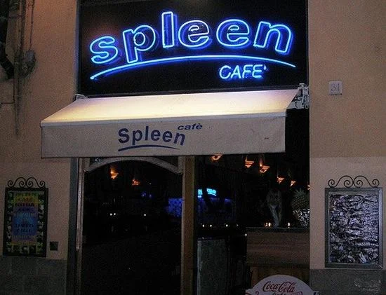 Funny Store Signs — Neon 'Spleen Cafe' storefront sign glowing blue at night