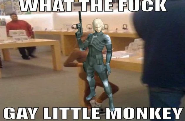 Gay Little Monkey Boy At Apple Store — Gray or blue armored character standing in Apple Store with 'WHAT THE FUCK' and 'GAY LITTLE MONKEY' captions.