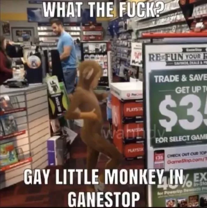 Gay Little Monkey Boy At Apple Store — Character in GameStop instead of Apple Store with captions 'WHAT THE FUCK?' and 'GAY LITTLE MONKEY IN GAMESTOP.'