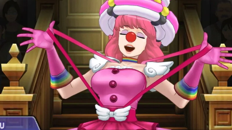 Geiru Toneido Ace Attorney Clown Girl — Official in-game screenshot of Geiru Toneido in pink clown costume with rainbow accents, standing dramatically in the
