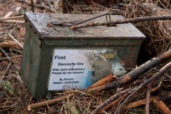 Geocaching — Historic first geocache site metal ammo box in the woods