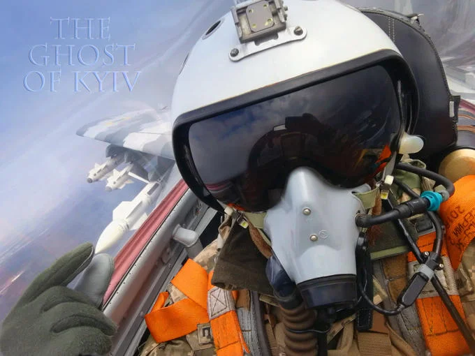 Fighter pilot cockpit selfie in white helmet with 'The Ghost of Kyiv' text overlay