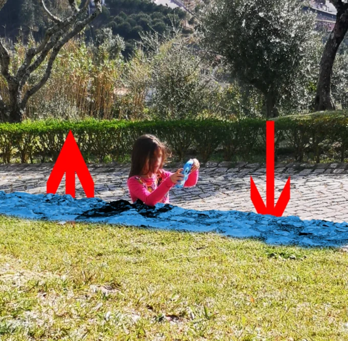 Girl Stuck In Concrete Illusion — Original illusion photo with graphic annotations including red arrows and blue highlighted area showing the perceptual