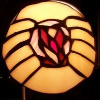 Goatse — Decorative art piece with hands framing a dark red center object