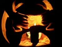 Goatse — Dark artistic silhouette image with glowing orange shapes