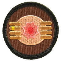 Goatse — Circular plate or decorative item with hands framing a center design
