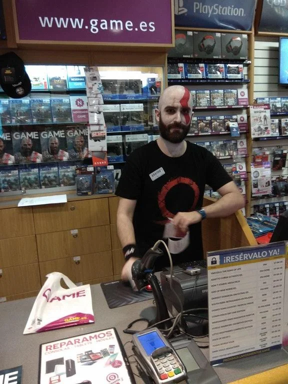 God Of War — Retail worker cosplaying as Kratos at a GAME store PlayStation counter