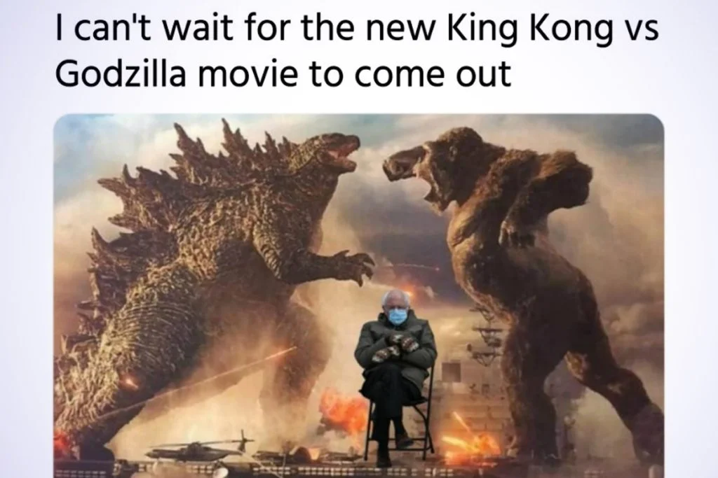 2021 Godzilla vs Kong battle scene with person seated below two monsters and 'waiting for the new movie' text overlay.