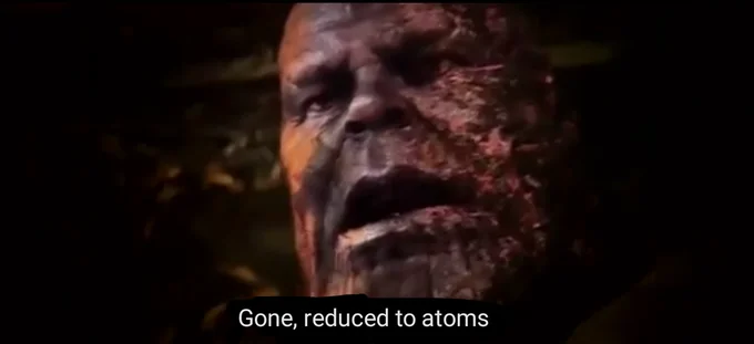 Gone Reduced To Atoms — Thanos in final disintegration scene with white text caption 'Gone, reduced to atoms.'