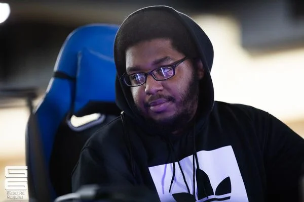 Good At Smash Bros Afro — Young Black man with afro and glasses in a purple-lit gaming streamer setup