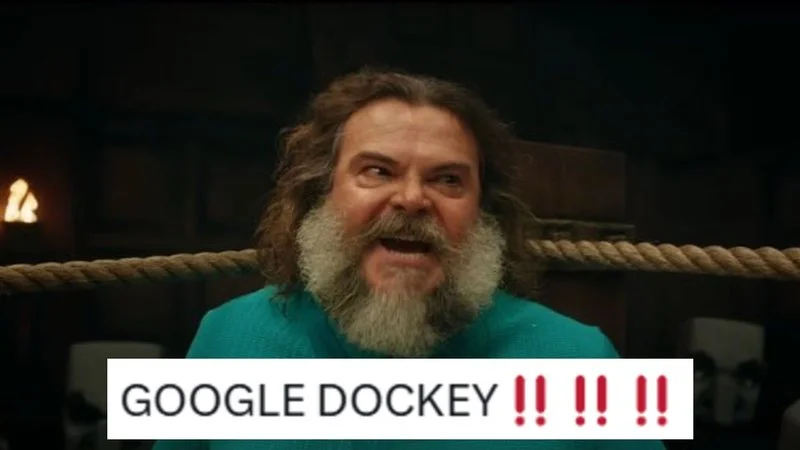 Jack Black as Steve from Minecraft Movie with excited shouting expression and 'GOOGLE DOCKEY !! !! !!' white text.