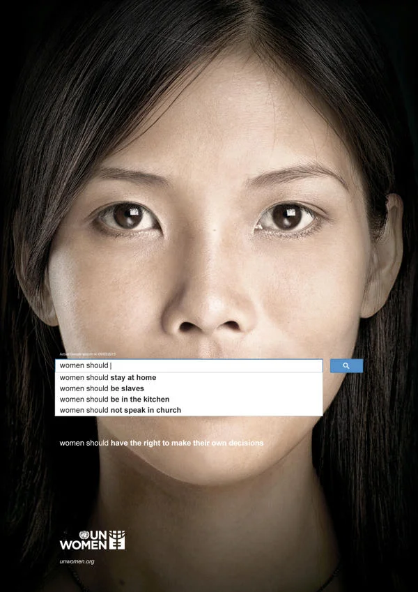 Google Search Suggestions — UN Women ad using Google autocomplete for 'women should' over a woman's face