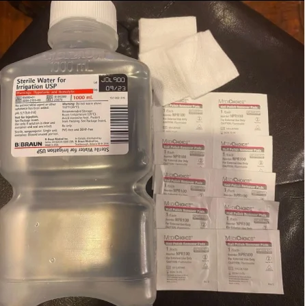 Gorilla Glue Girl — Bottle of sterile water and packets of adhesive remover used in the treatment