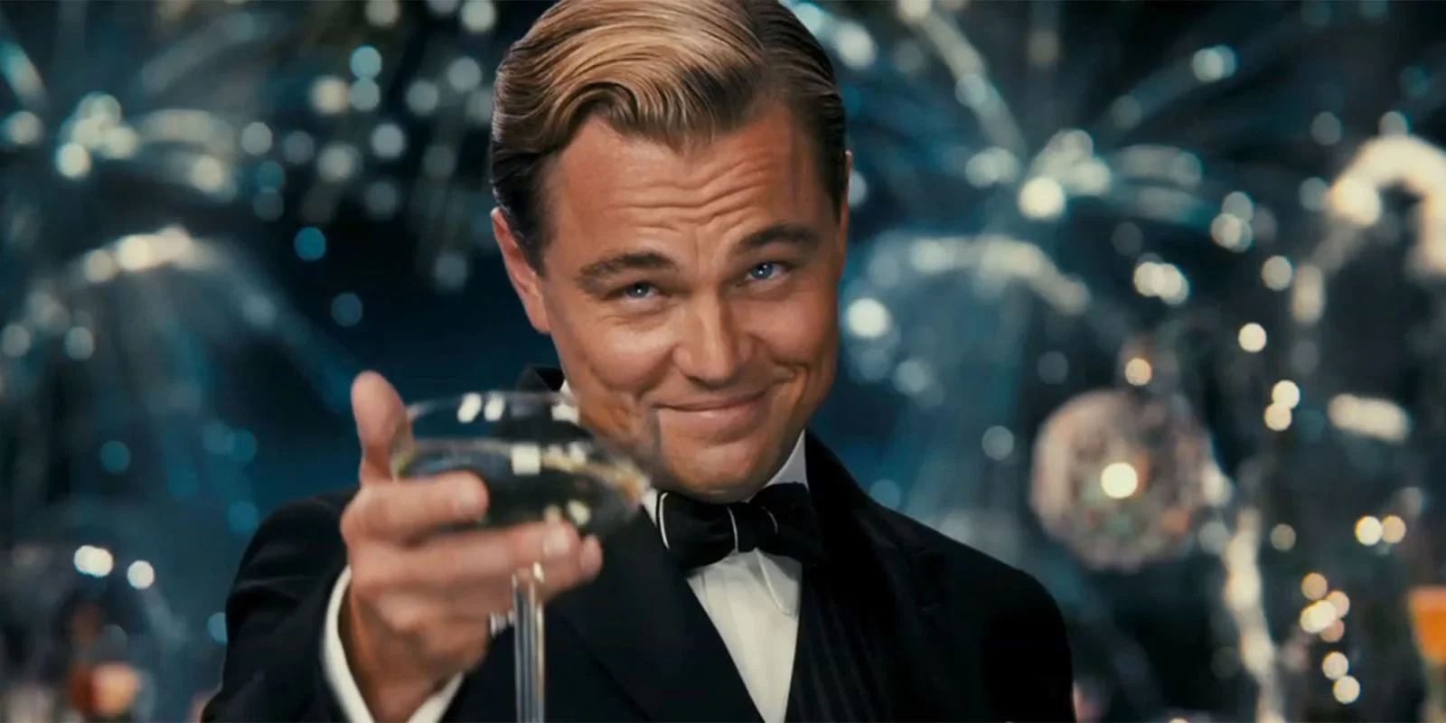 Great Gatsby Reaction — Leonardo DiCaprio as Jay Gatsby in a tuxedo raising a champagne glass with a smirk against a fireworks backdrop