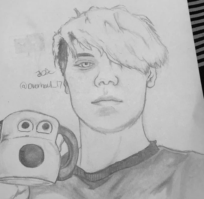 Black and white pencil sketch showing person profile next to Gromit Mug sketch with artist signature.