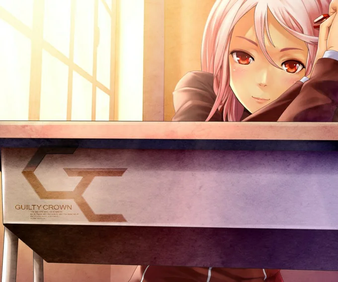 Inori Yuzuriha behind a desk showing the Guilty Crown logo