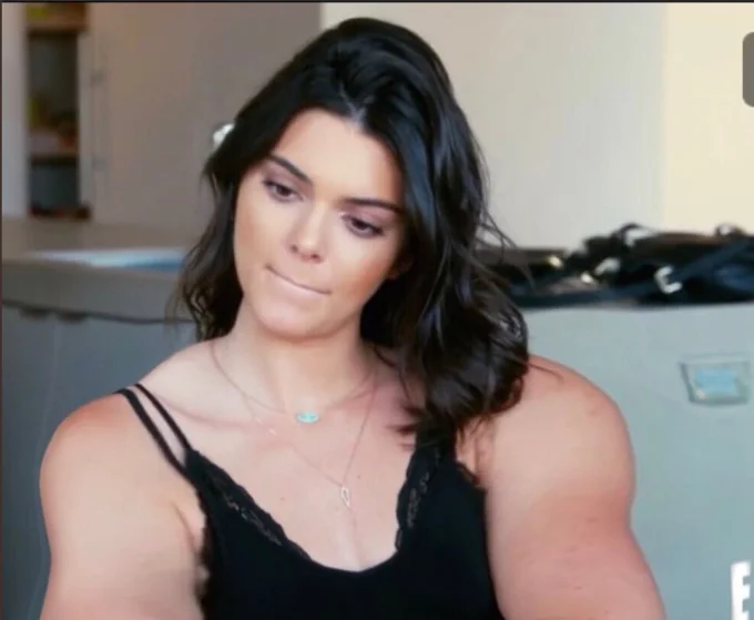 Gym Kardashian — Khloe Kardashian in kitchen with Kim in background, unedited reality show still