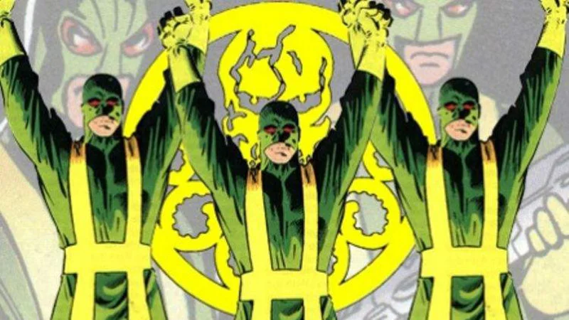 Hail Hydra — A panel from Marvel Comics showing three Hydra agents in green and yellow uniforms with arms raised before a glowing yellow Hydra octopus-skull