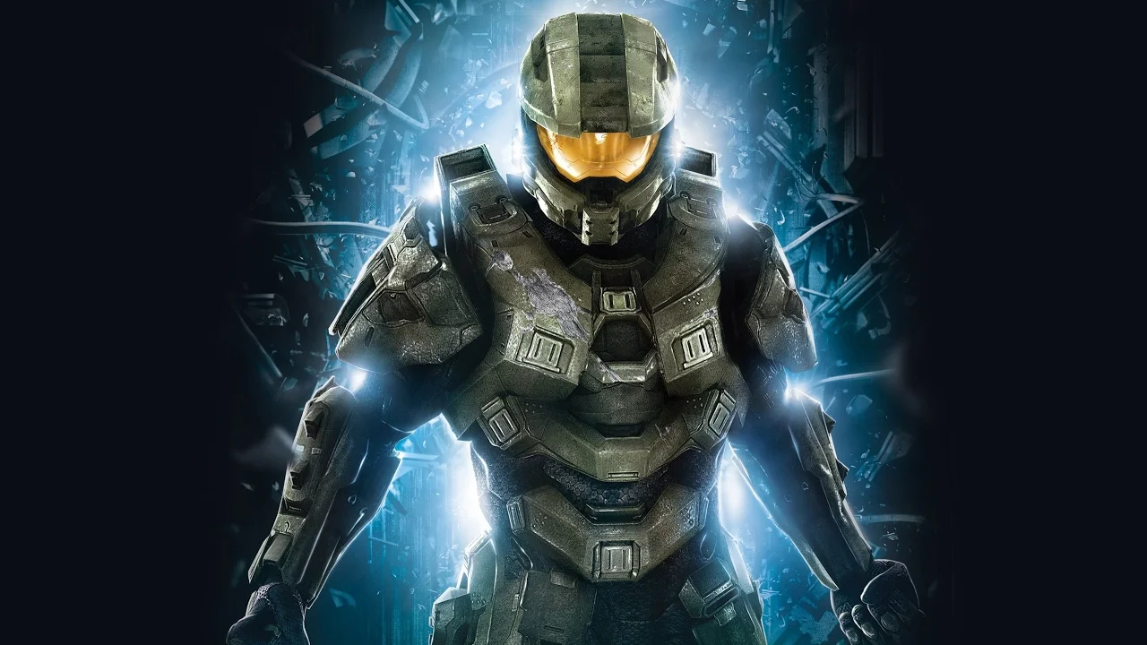 Halo — Master Chief in green Mjolnir armor with orange visor against a dark shattered background