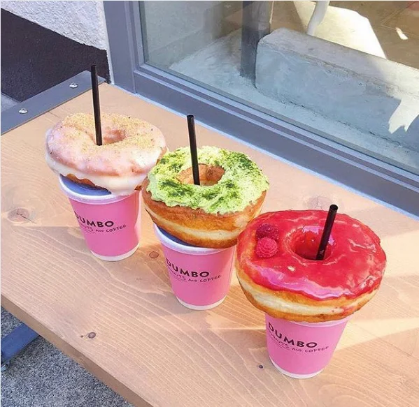 Hamburger Straws — Three Dumbo coffee cups with glazed donuts on top and straws through the donut holes