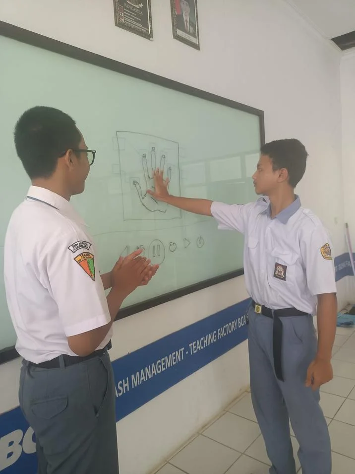 Hand Scanner Video Fail — Two students recreating the hand-scanner pose on a hand-drawn whiteboard interface