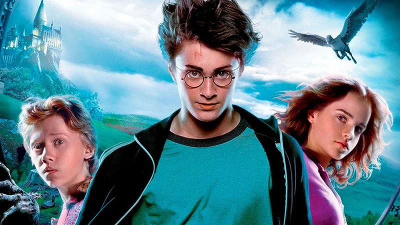 Harry Potter — Harry, Ron, and Hermione in front of Hogwarts castle in Prisoner of Azkaban promotional art