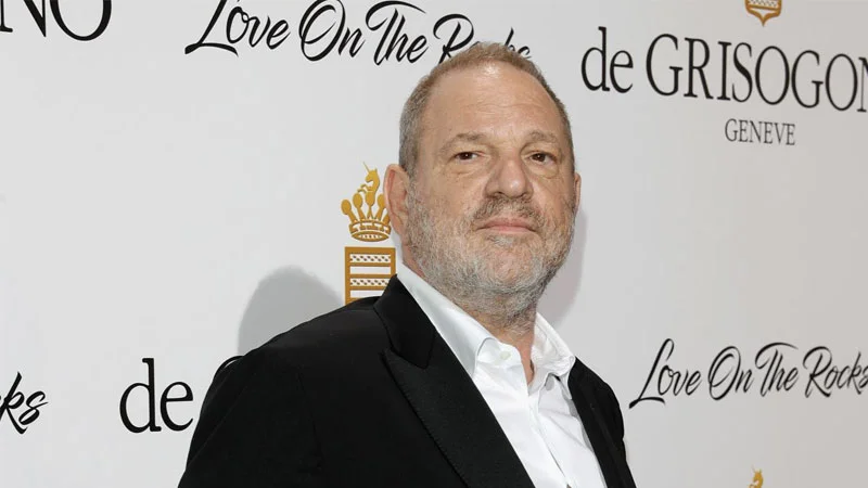 Harvey Weinstein Sexual Abuse Cases — Harvey Weinstein posing on a red carpet in a black tuxedo