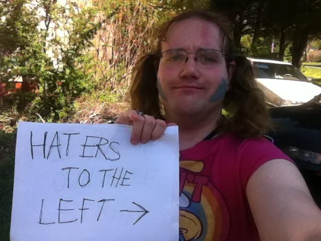 Glee cheerleaders clapping in a gym with 'Haters to the Left' caption