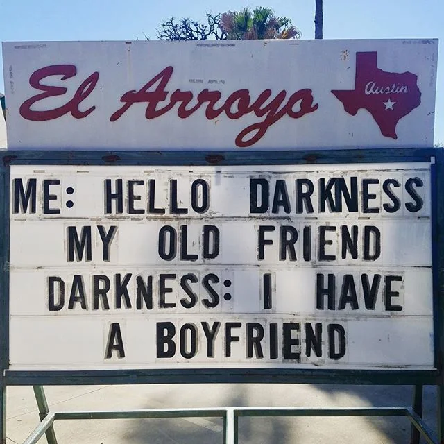 Hello Darkness, My Old Friend — El Arroyo Austin marquee sign displaying the 'Hello darkness my old friend / I have a boyfriend' joke.