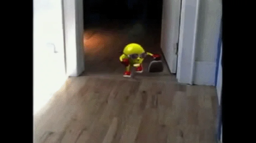 Here Comes Pacman — Animated GIF of the yellow Pac-Man toy from the viral 'here comes Pac-Man' video.