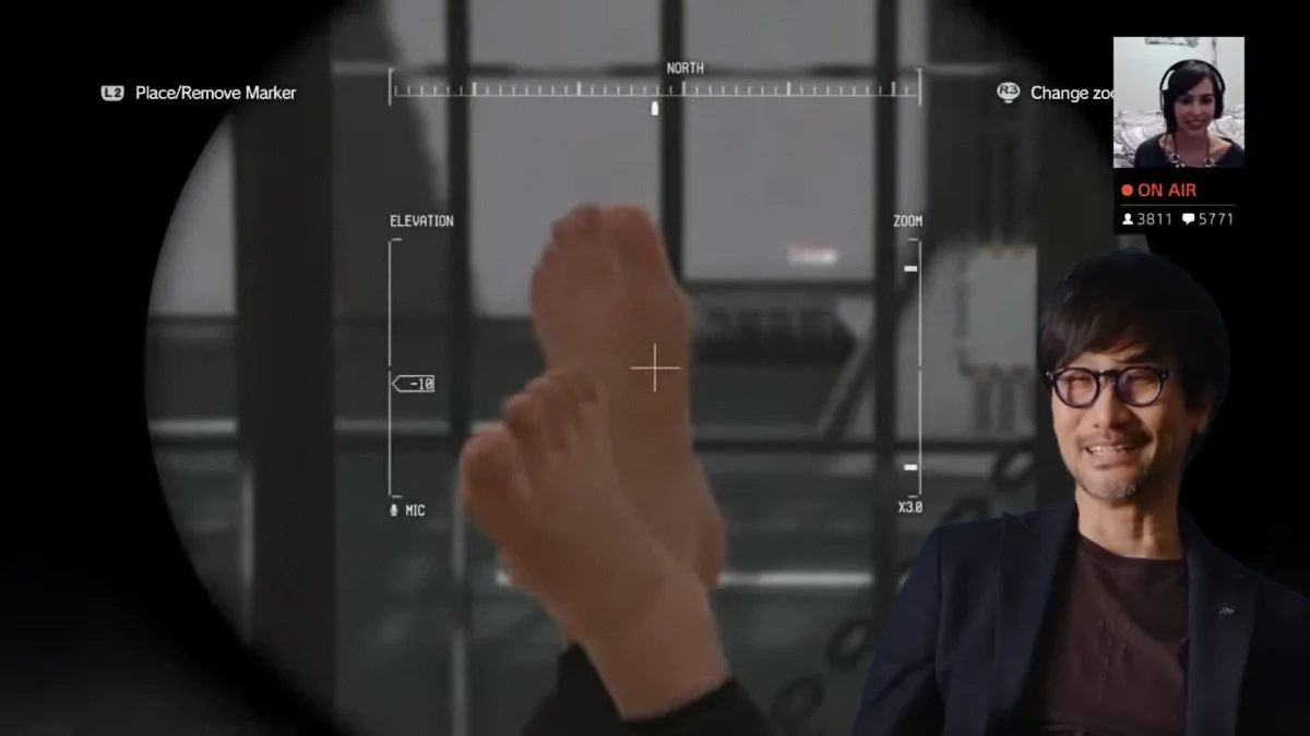 Hideo Kojima Feet Scans Foot Fetish — Hideo Kojima smiling next to MGSV binoculars scope focused on bare feet during a livestream