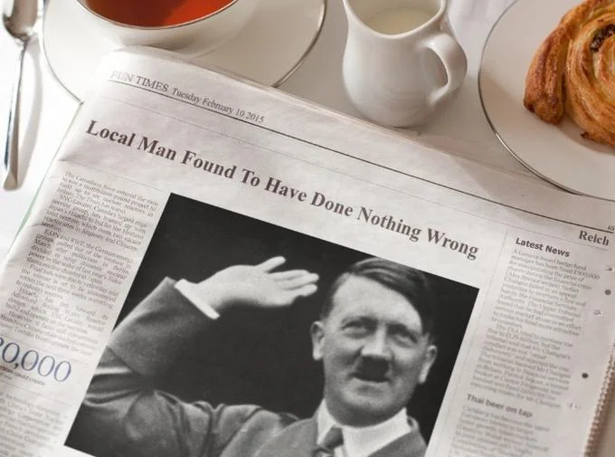 Hitler Did Nothing Wrong — Newspaper spoof headline Local Man Found To Have Done Nothing Wrong above Hitler photo